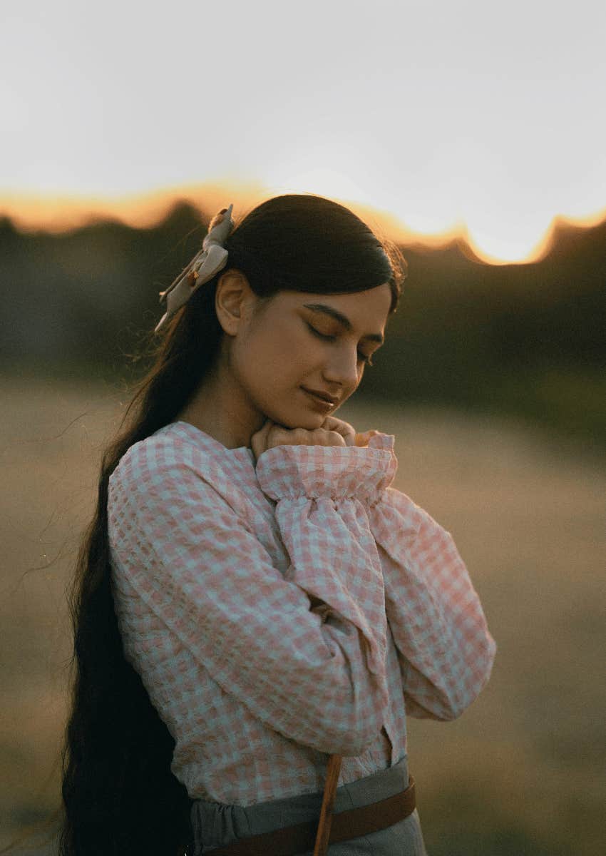 woman with her eyes closed and a peaceful expression