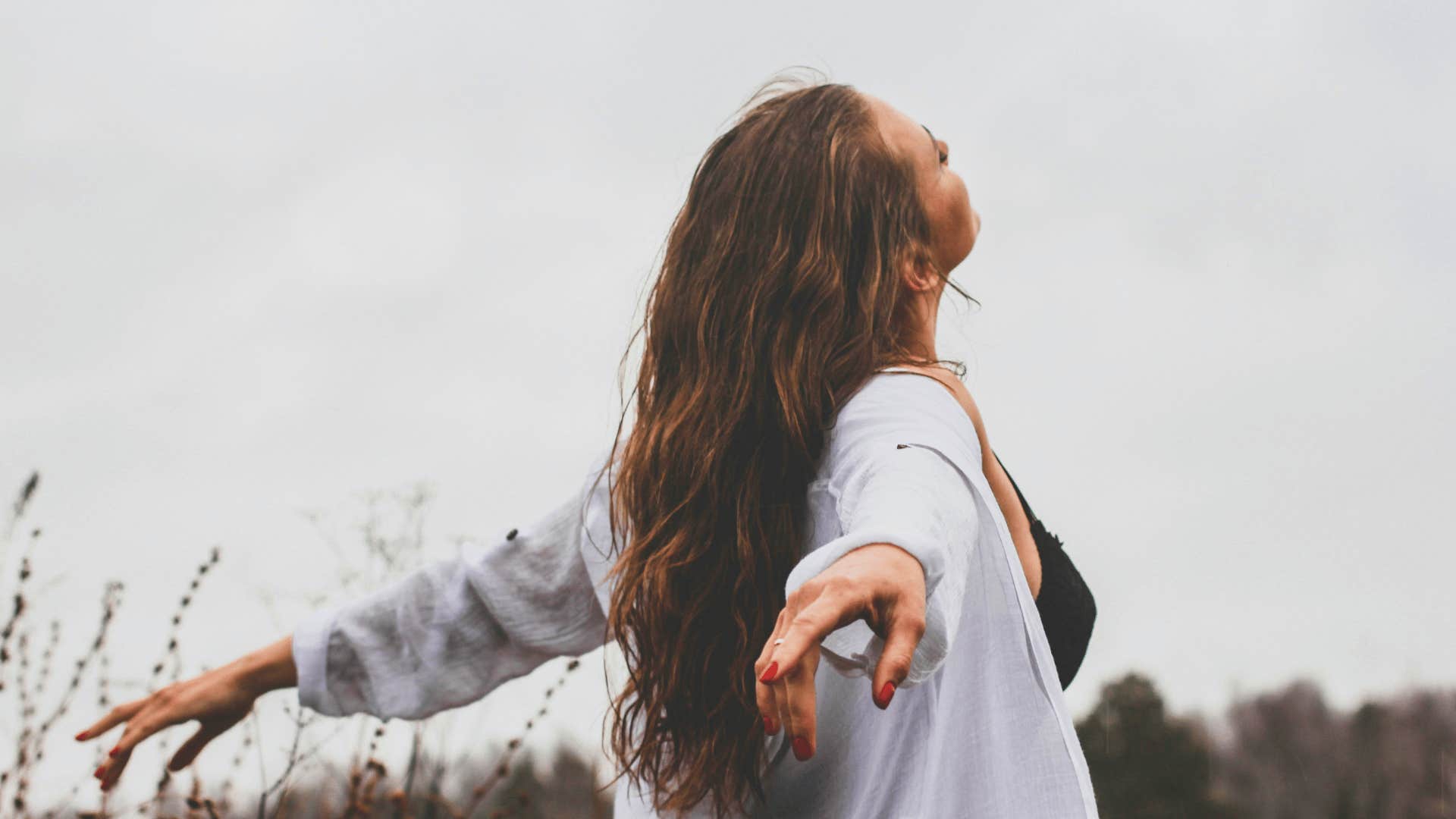 woman getting fresh air to keep from spiraling