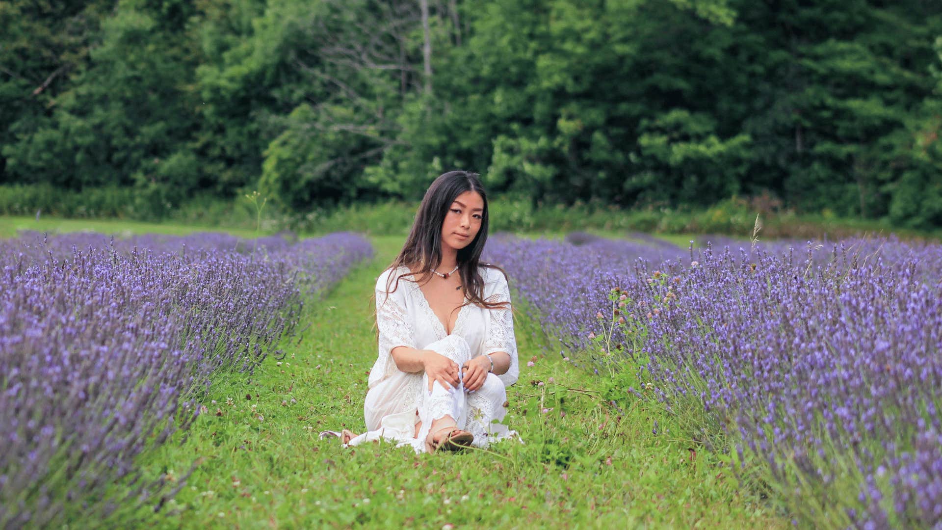 woman sitting and inhaling lavender aroma to keep from spiraling