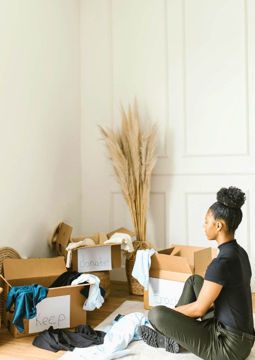 woman sorting item to either donate or keep