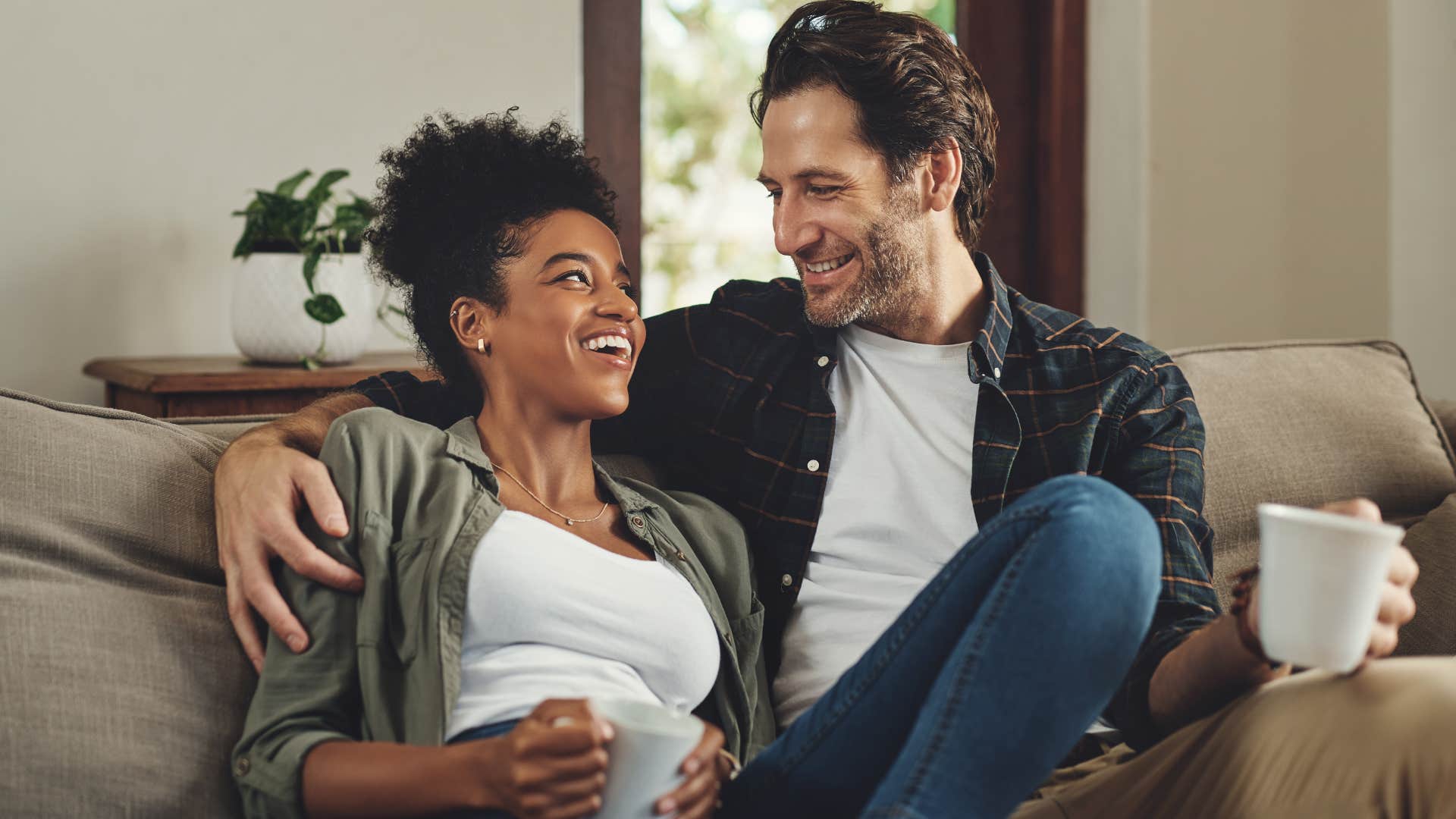 Woman smiling with her husband who keeps his promises.