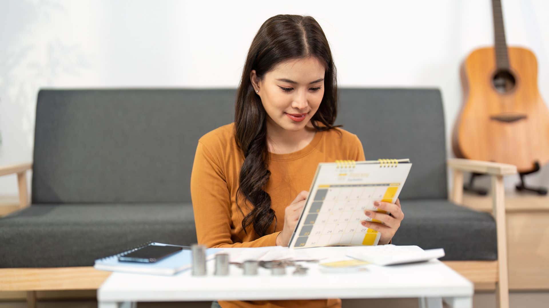 woman who enjoys being in control looking at her planner
