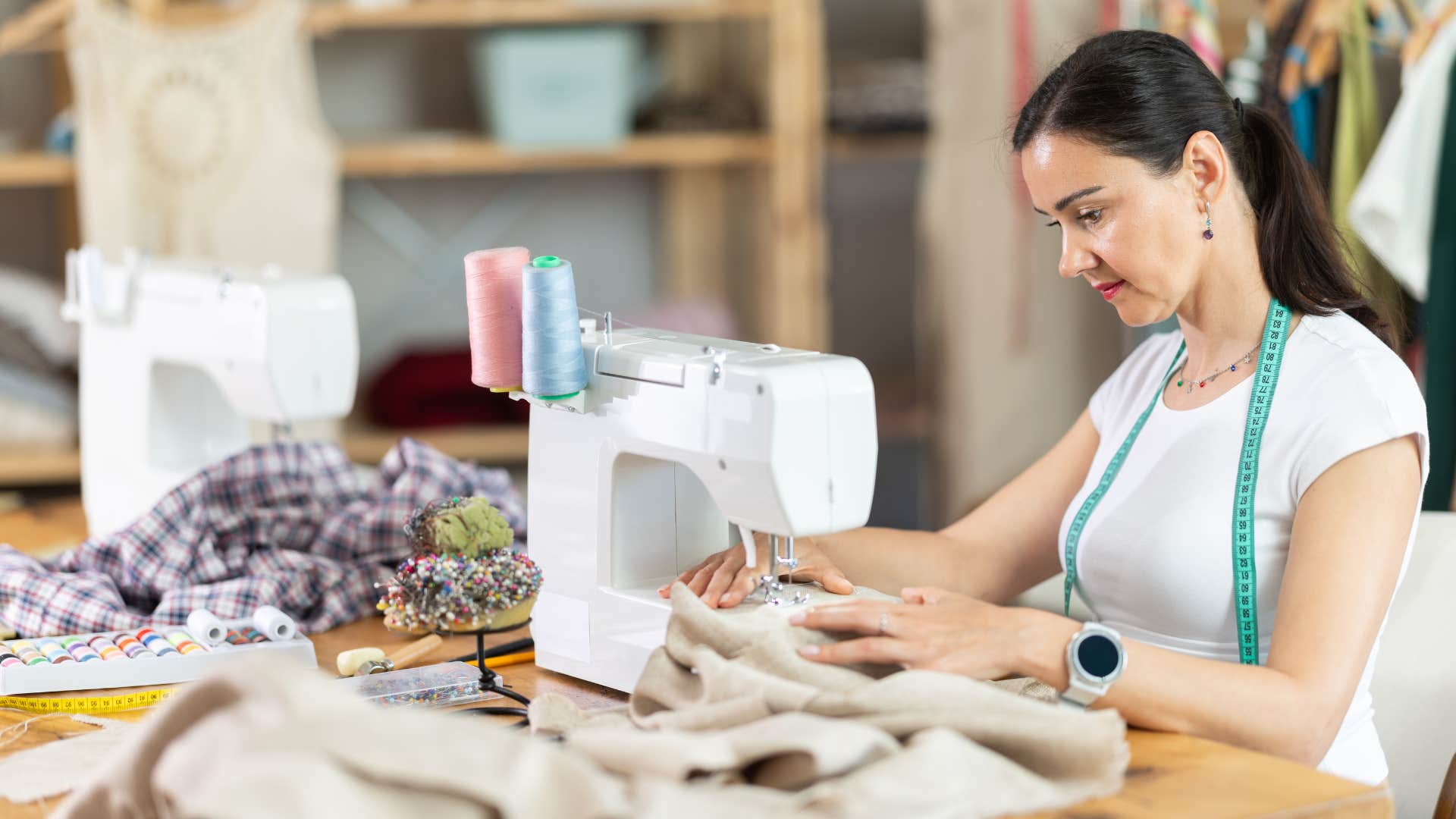 creative woman using a sewing machine