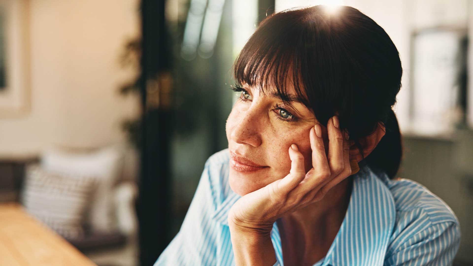 romantic woman daydreaming and smiling