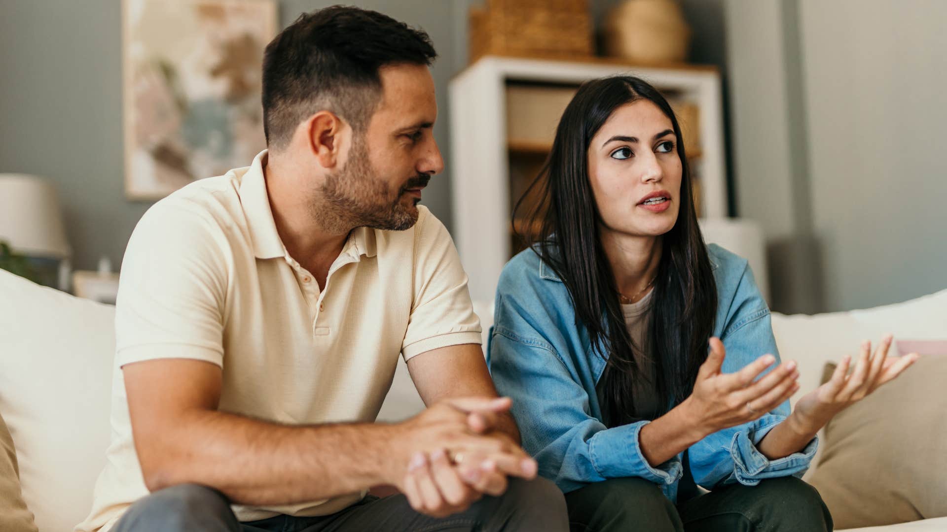 woman making comparisons with her husband at home