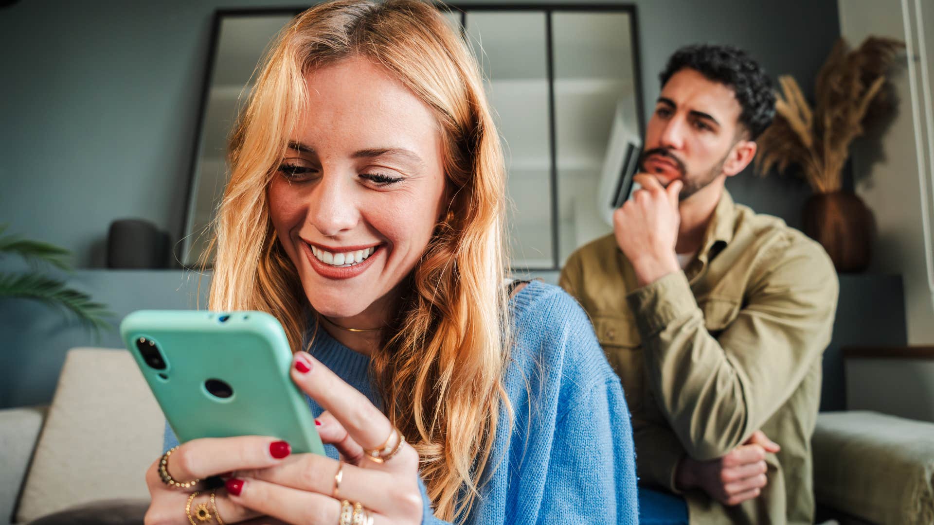 woman on her phone keeping secrets from her husband