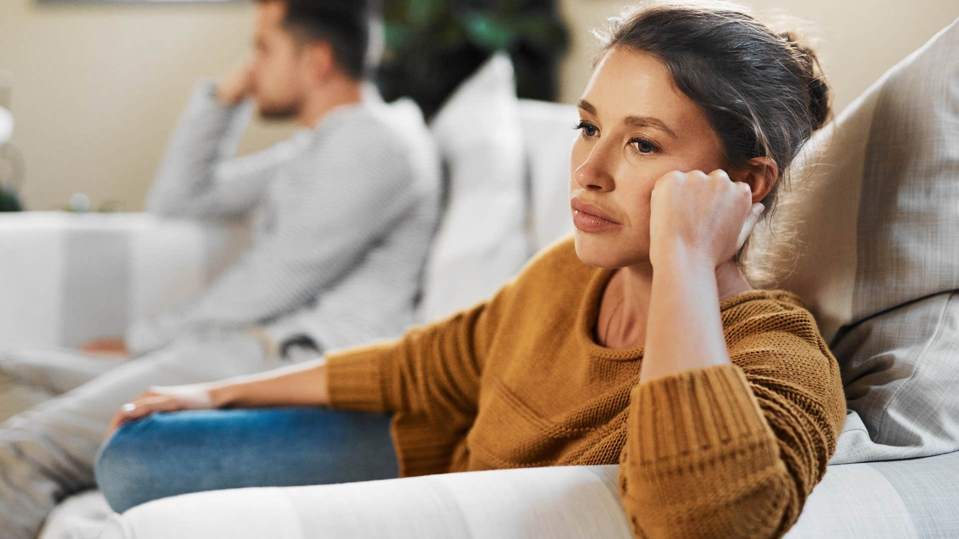 woman with misguided humor sitting away from partner