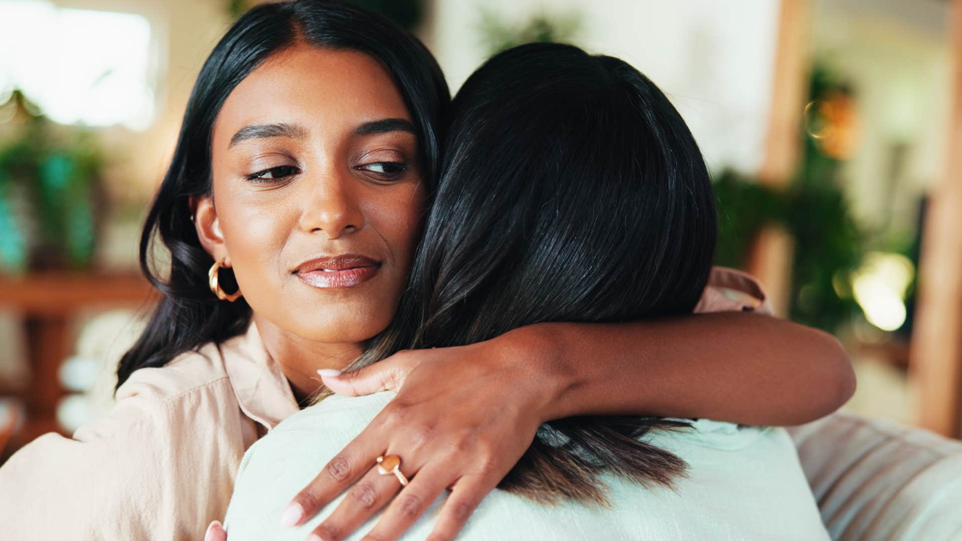 women in toxic friendship hugging reluctantly