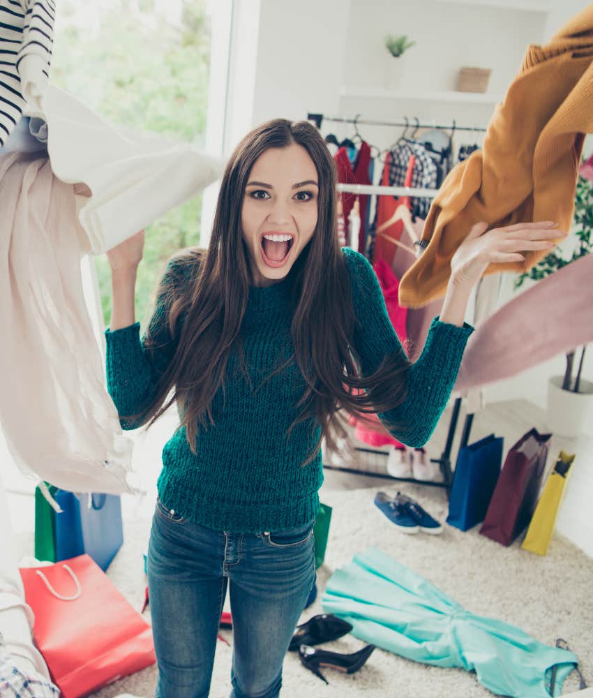 Frustrated woman throws clothes in the air showing can't look good for situationship