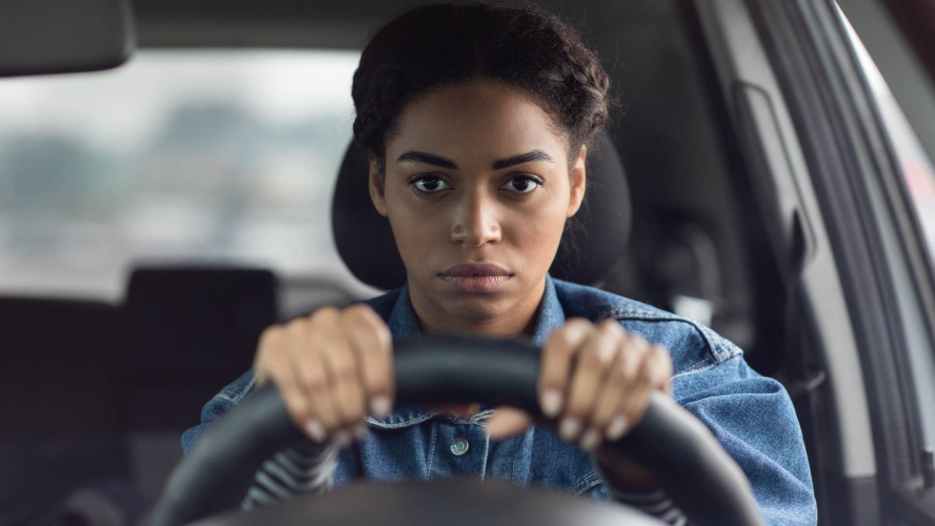 Woman who doesn't like second-guessing themselves in her car.
