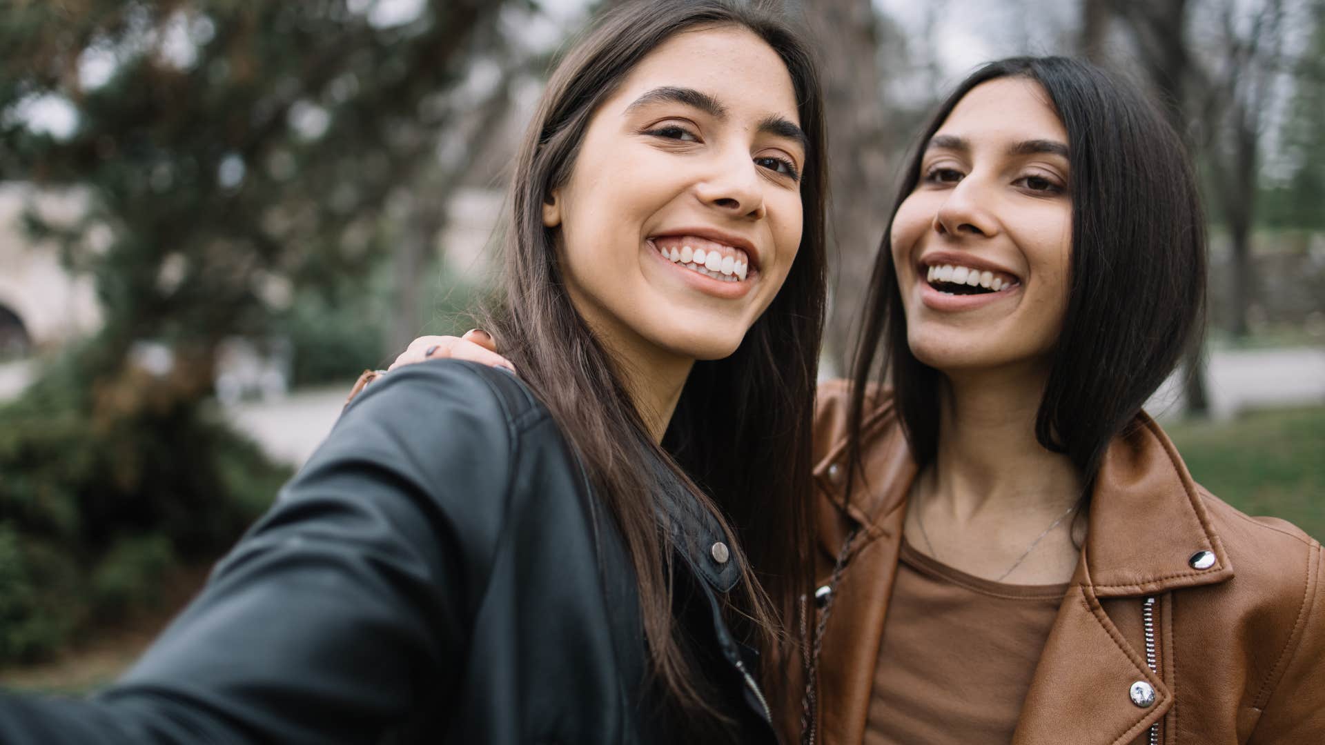 true good friends smiling and not being interested in status