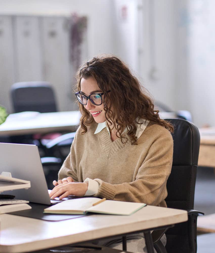 happy european woman working in office