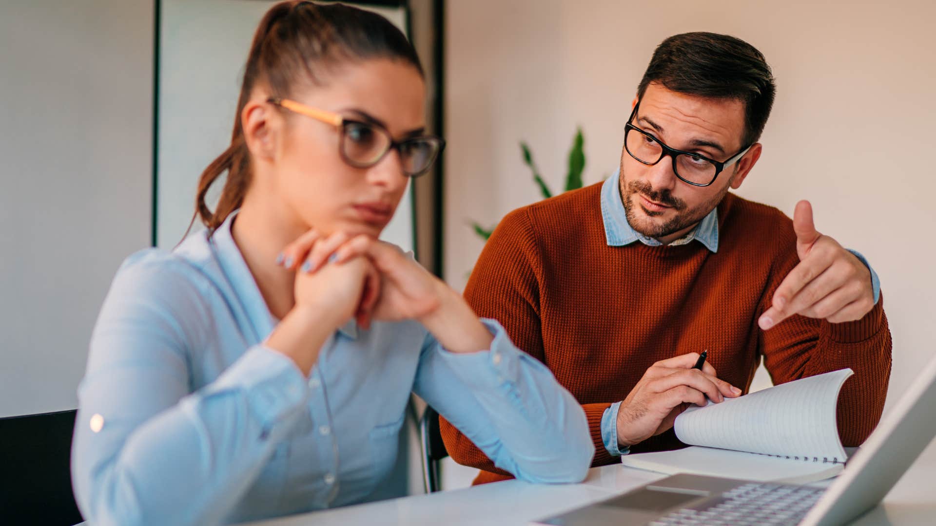 Man who overcomplicates everything talking to a co-worker.