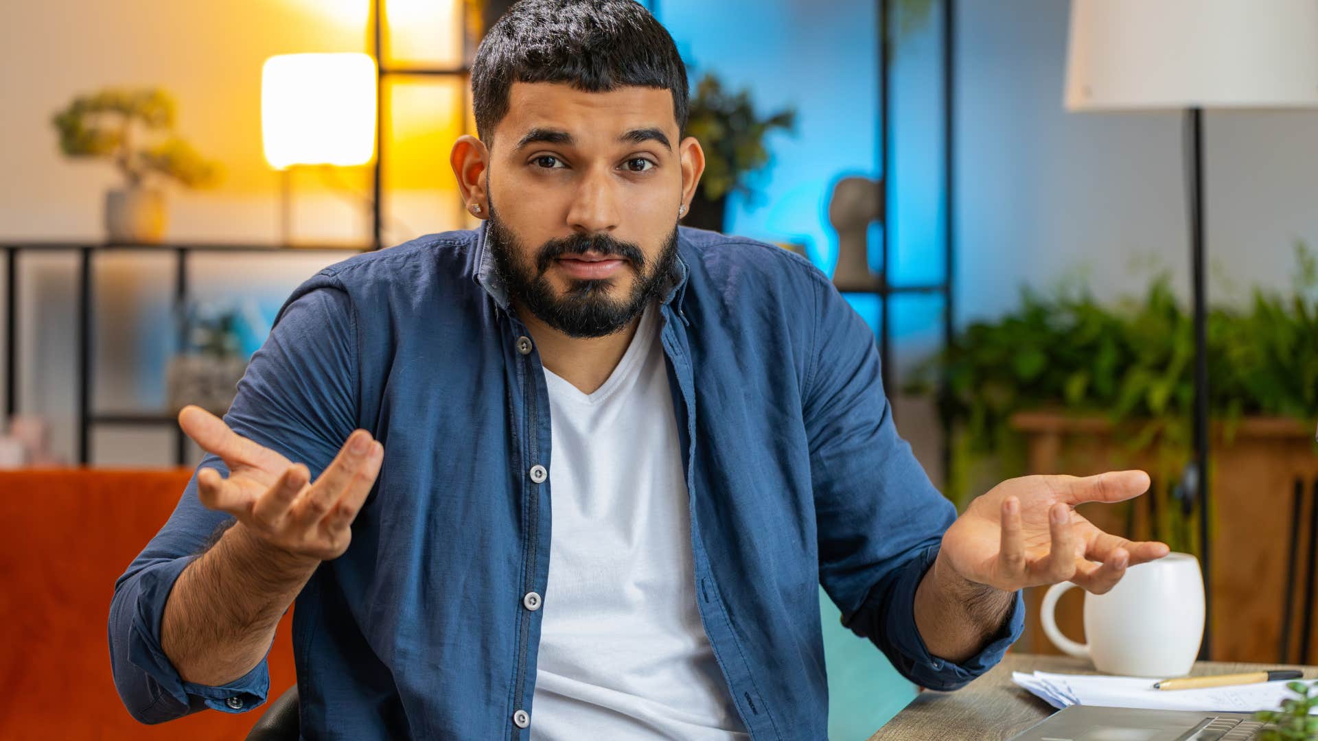 Man who weaponizes ignorance shrugging at home.