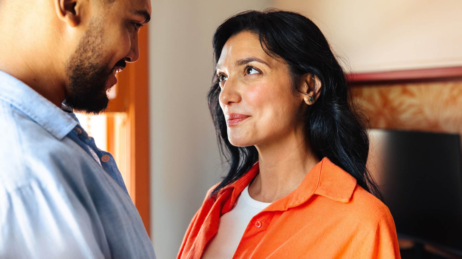 Hopeful couple hold eye contact showing way to tell he loves you