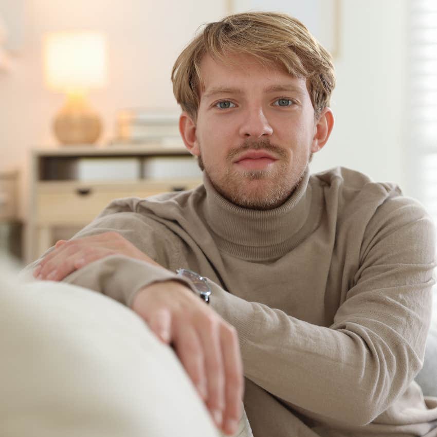 Man whose home feels frozen in time sitting on a couch