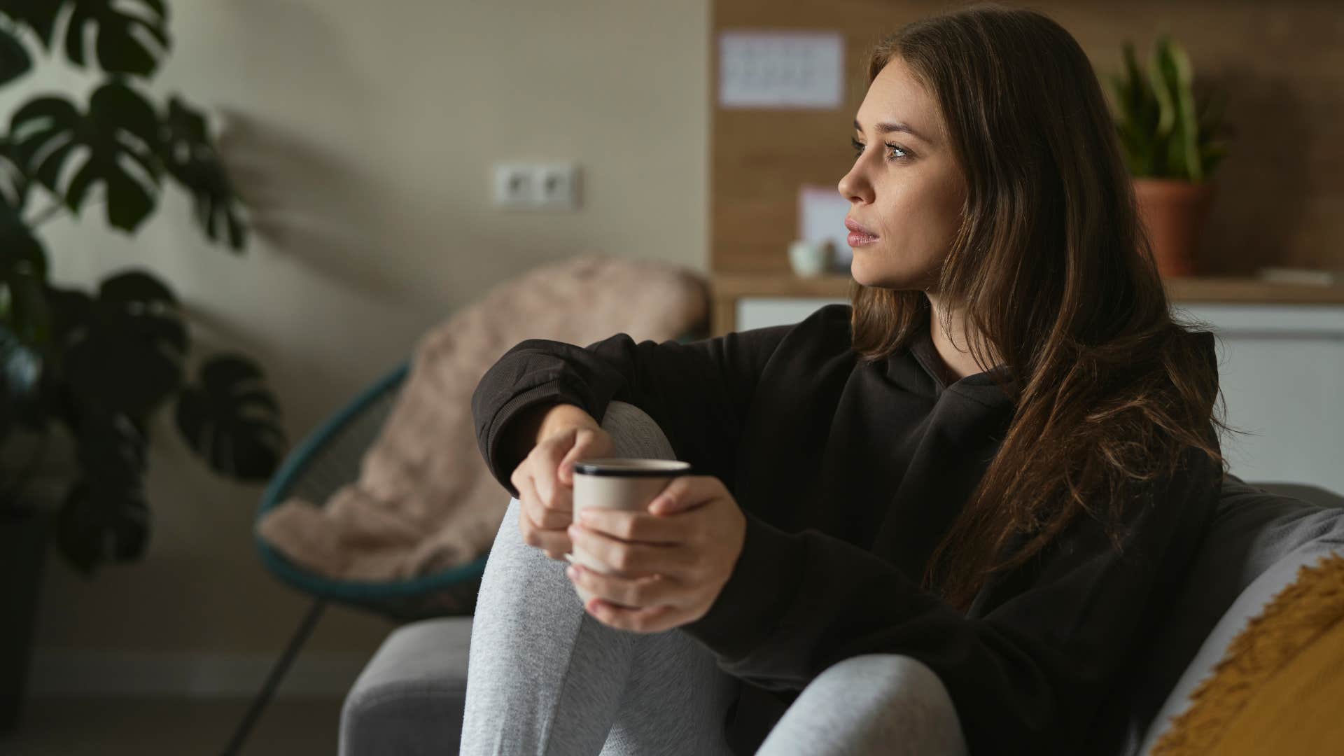 woman sitting in home where the color scheme is personal