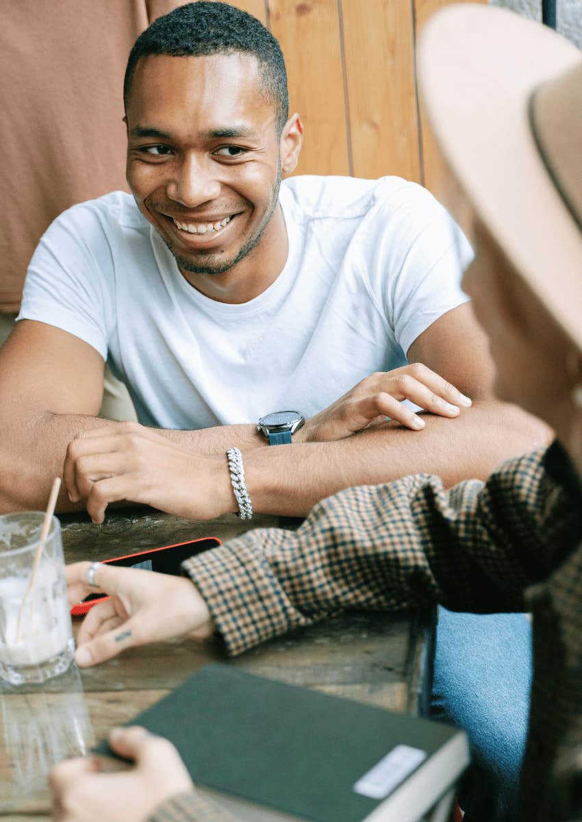 young man smiling at his friend