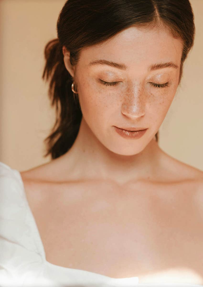 young woman with her eyes closed in a peaceful expression