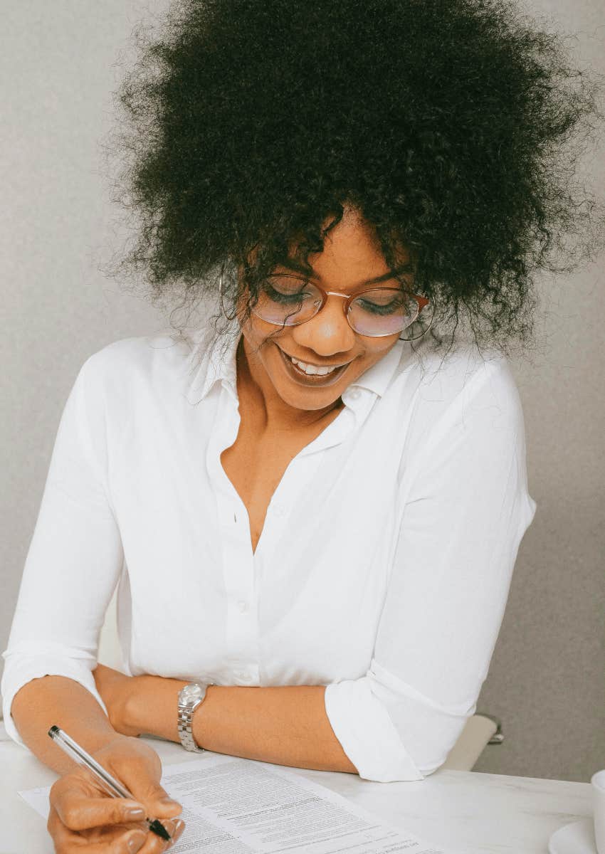 young woman reading a document