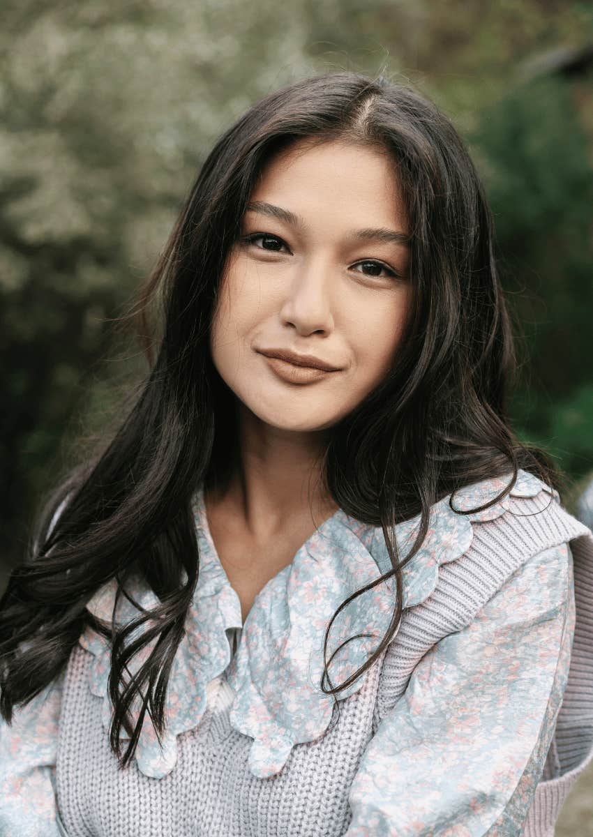 young woman smiling softly