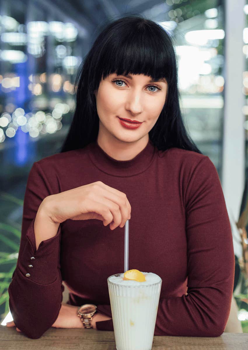 young woman smiling softly 