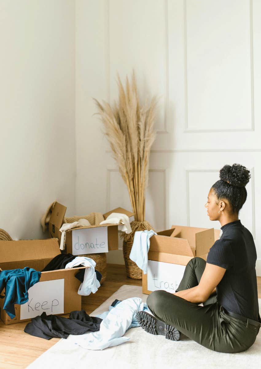 young woman sorting items to donate
