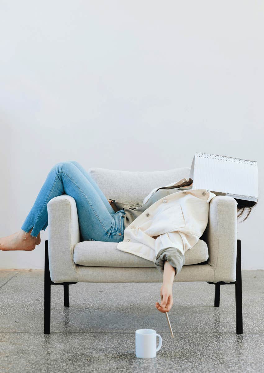 young woman taking nap in chair