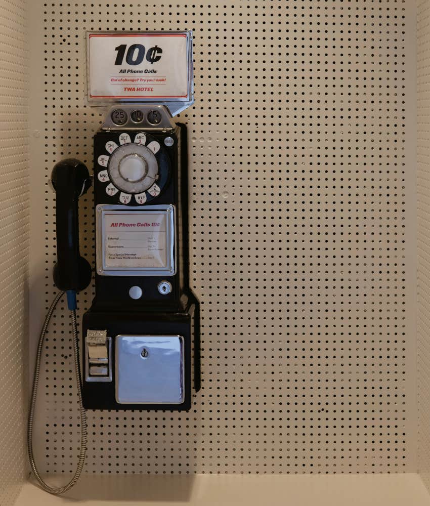 Vintage 1960s payphone with 10 cent sign
