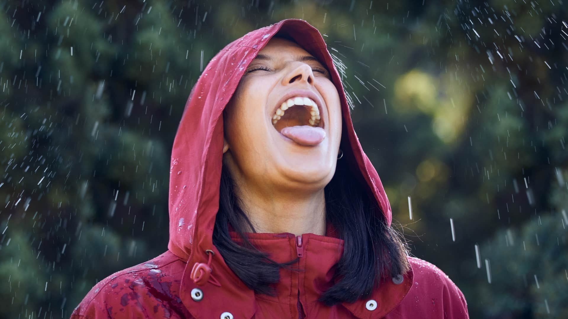 Excited person outside catches rain on tongue showing way to get better at life