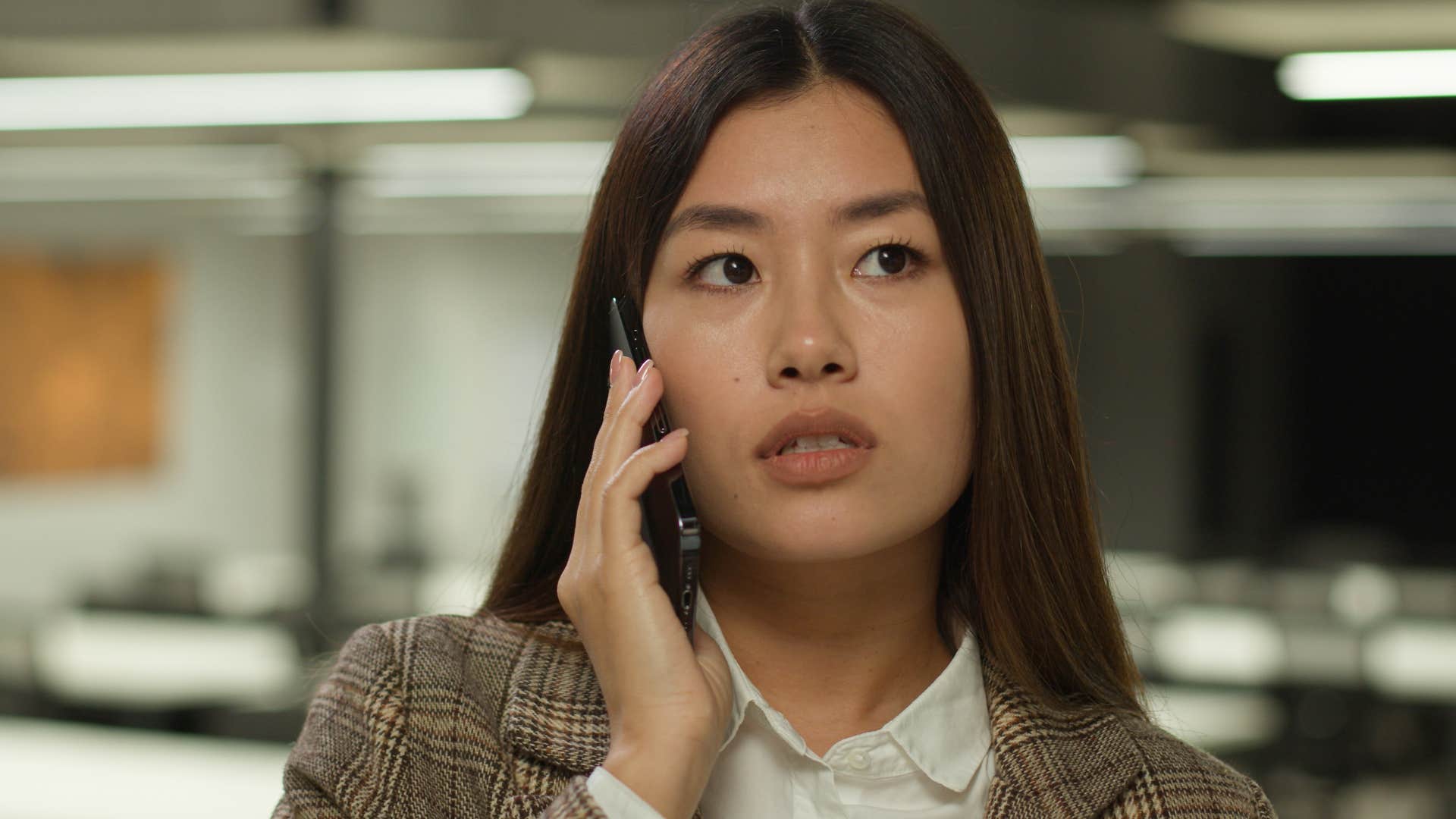 woman secretly struggling feeling tired on the phone