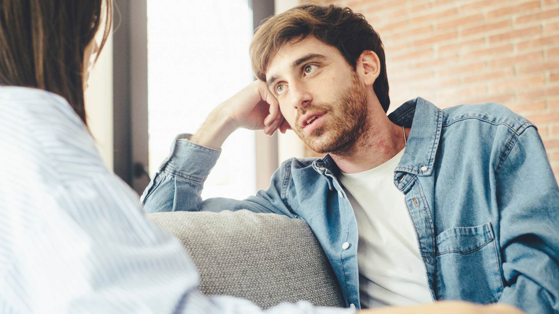 man engaging in superficial conversations with his partner