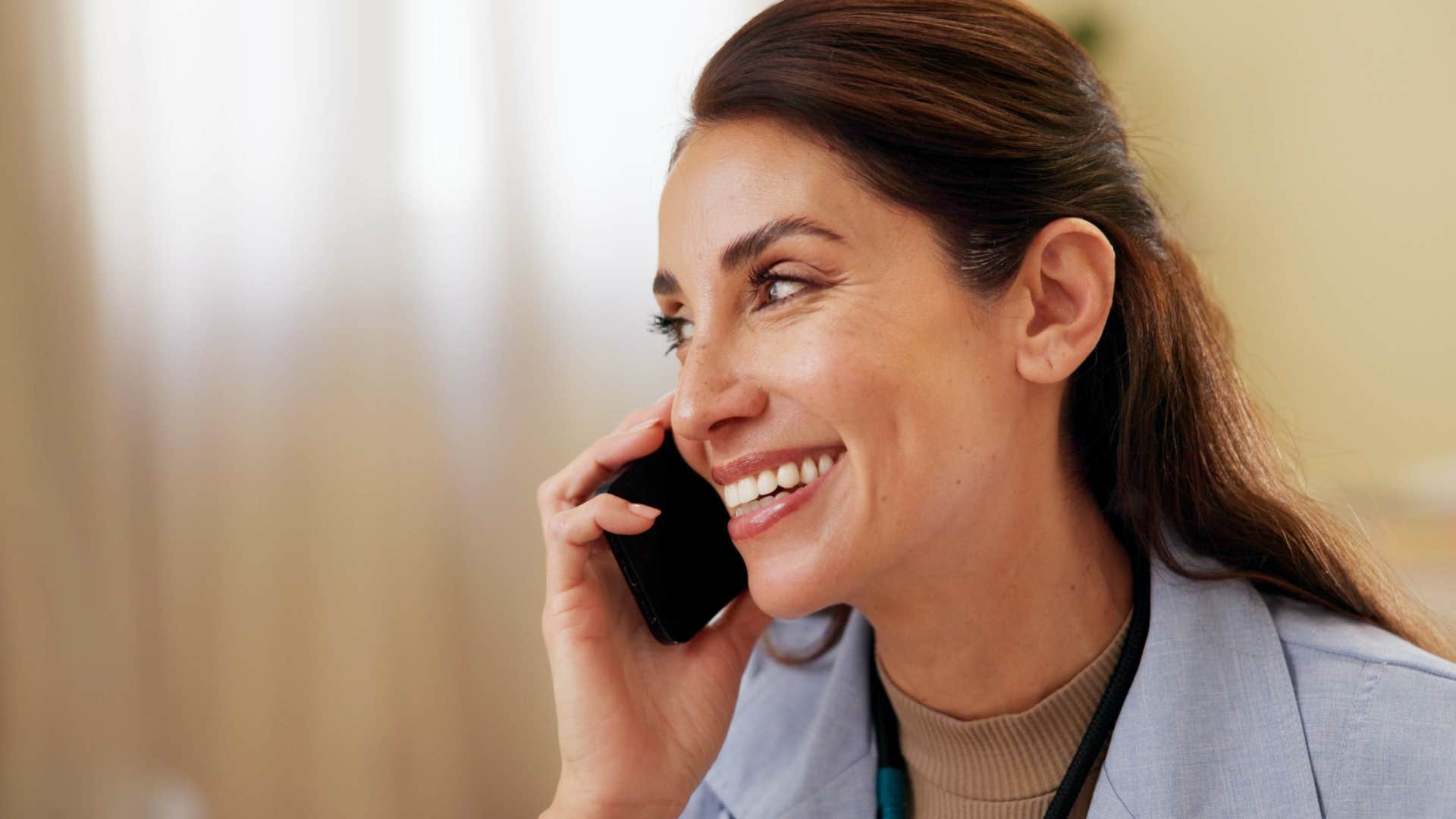 woman actively listening to her parents talking on the phone