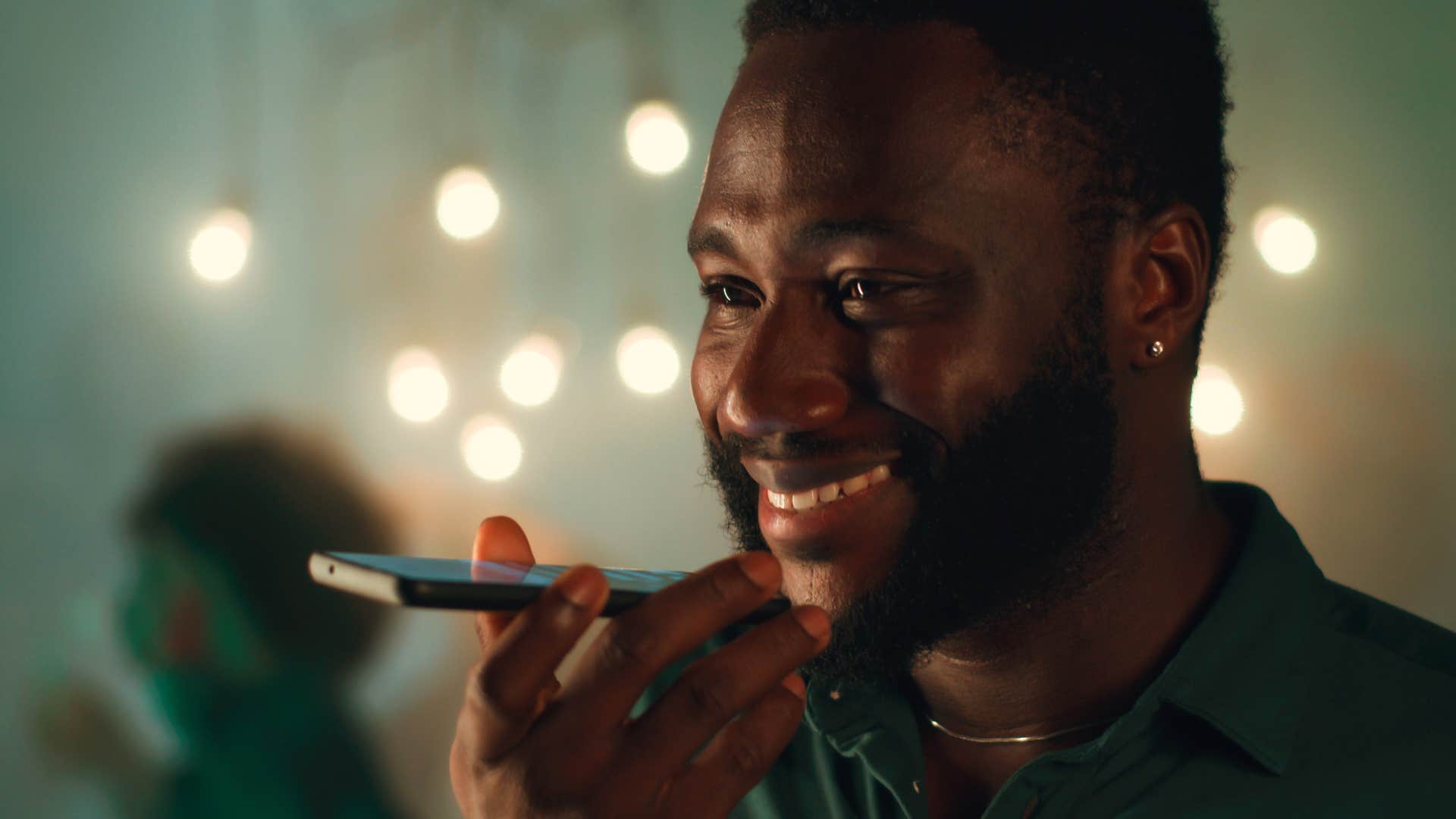 caregiving man talking to his parents on speakerphone