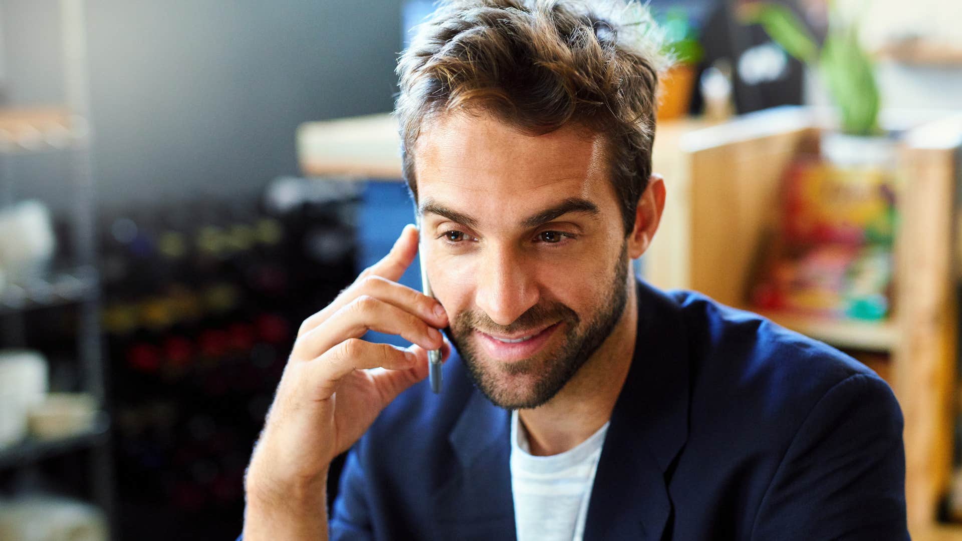 man who's an open communicator talking on the phone with his parents