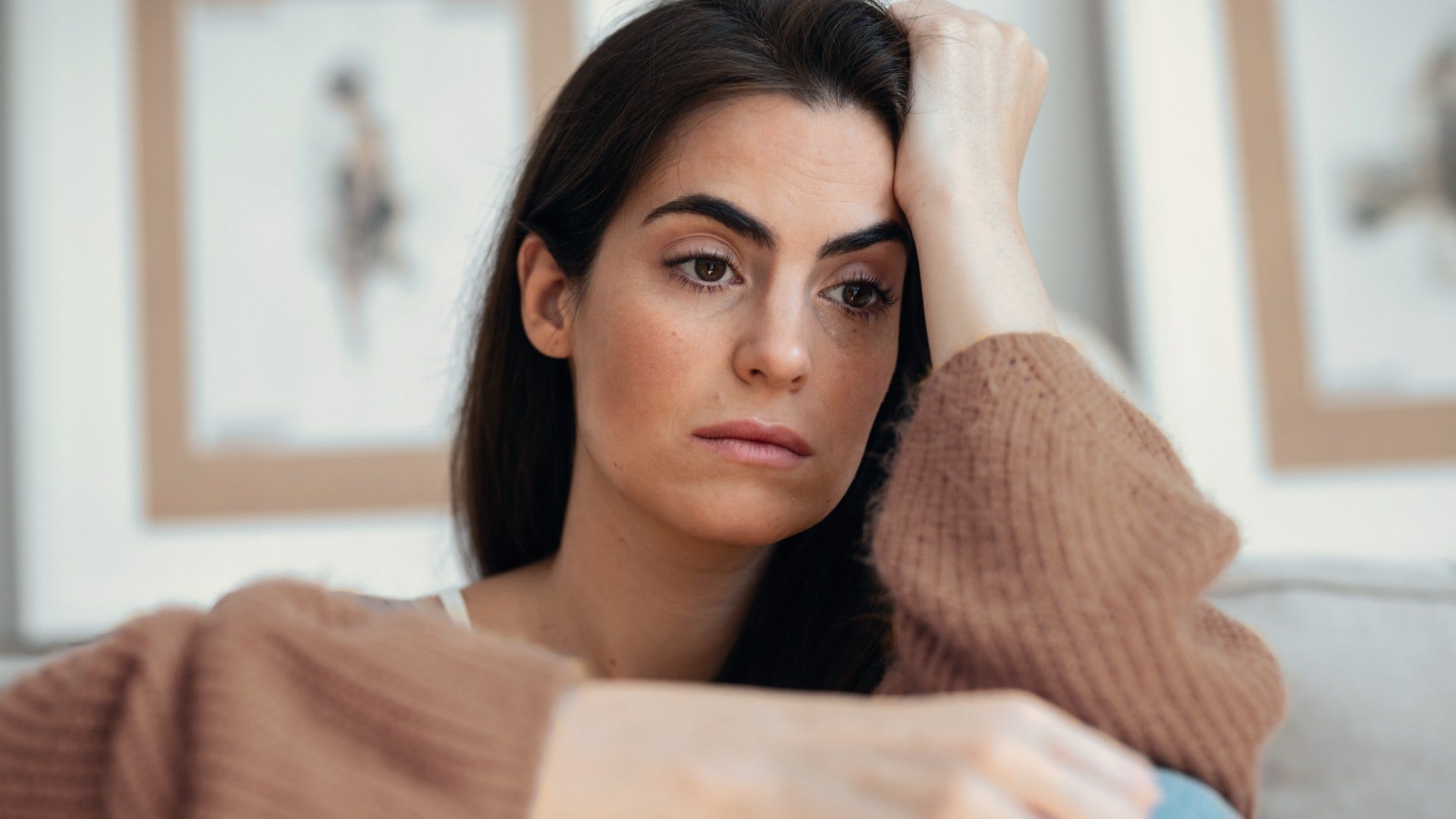 woman who feels anxious in love as she makes it worse with unhelpful coping outlets