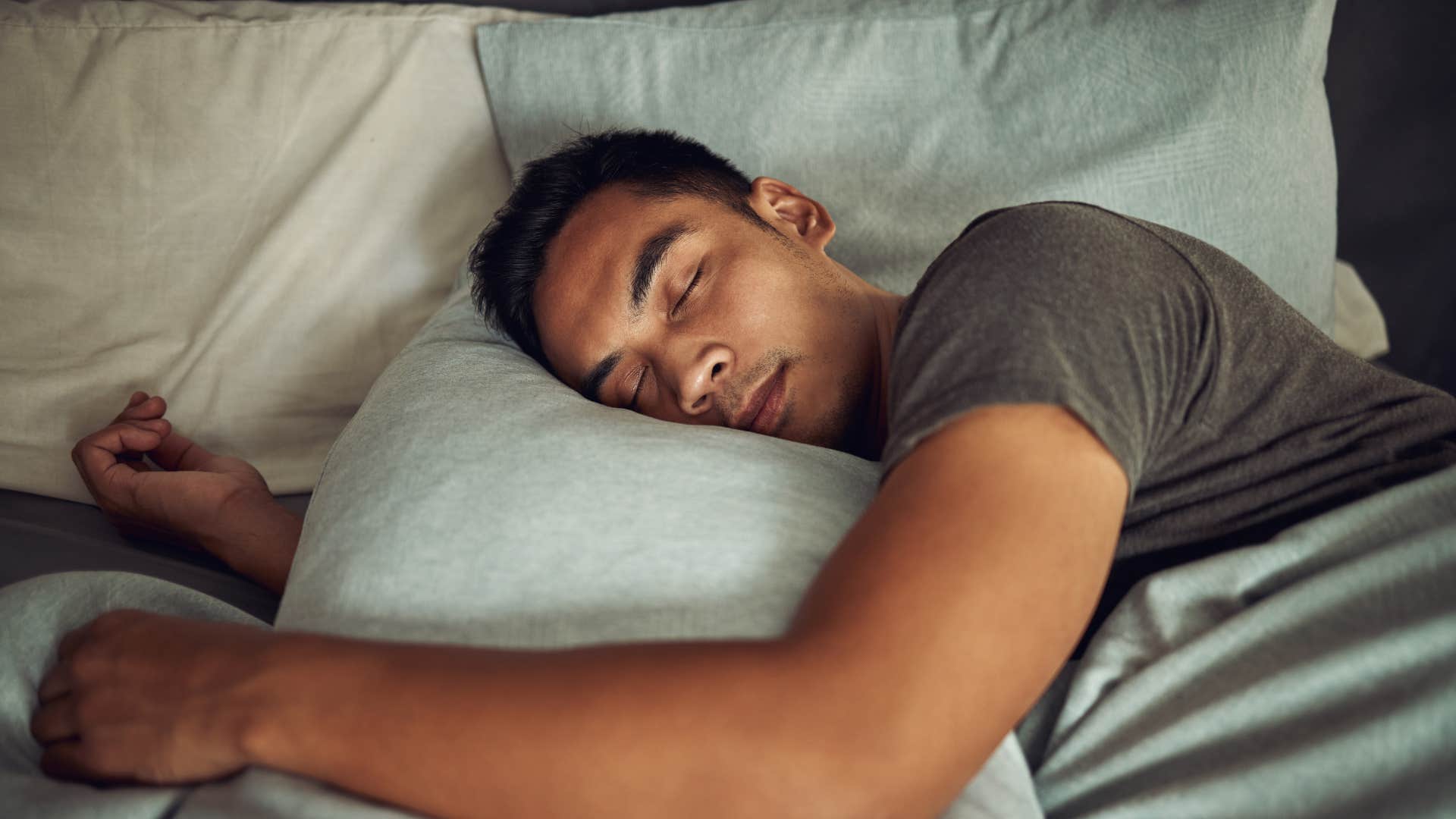 exhausted man resting in bed