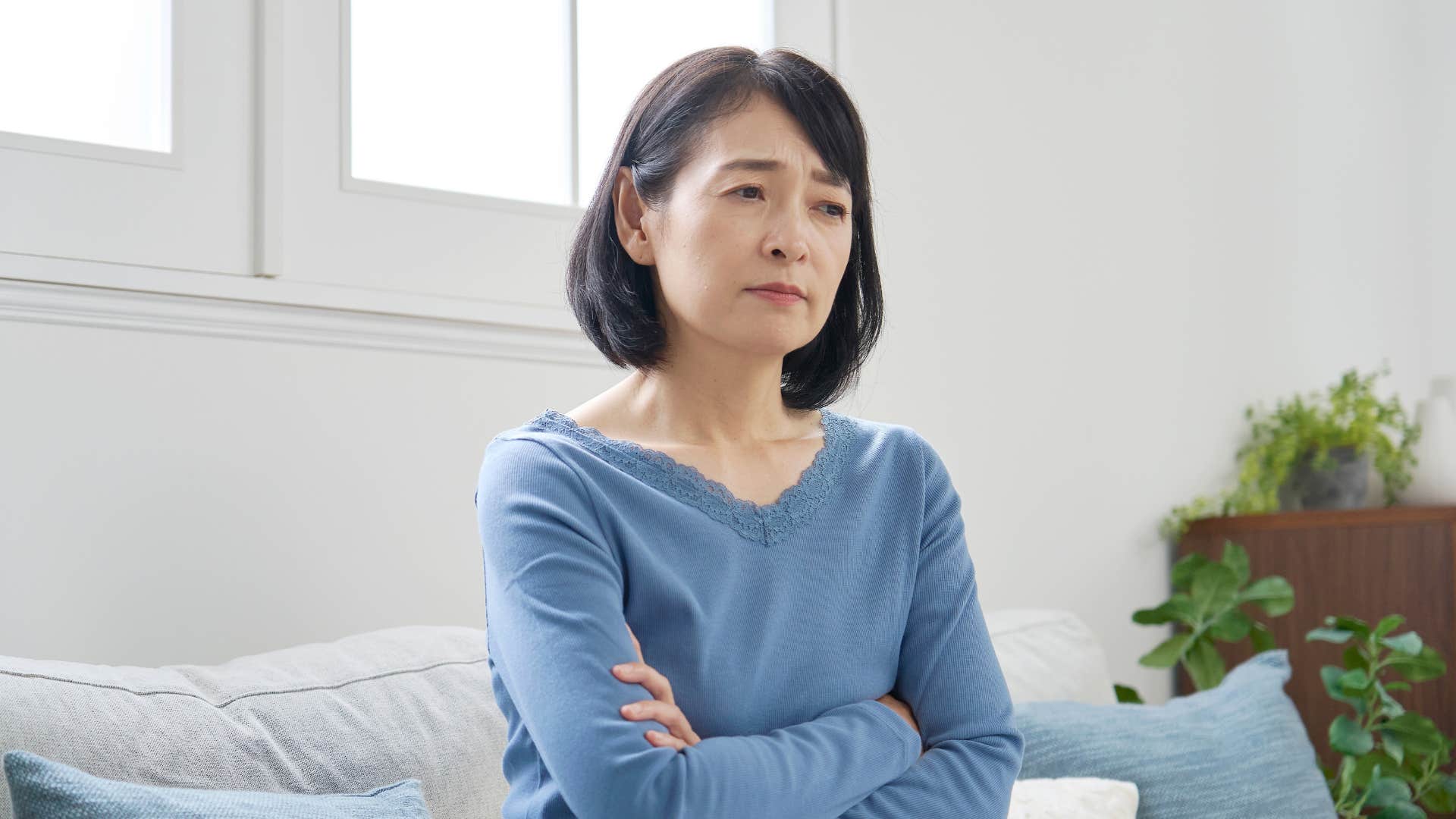 irritable woman feeling unhappy alone at home