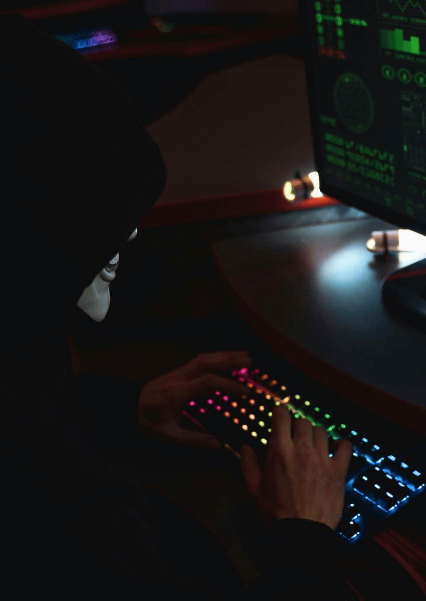anonymous man typing on computer