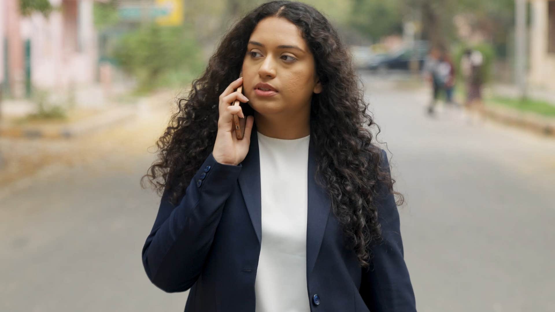 gen z woman canceling plans at the last minute from her phone