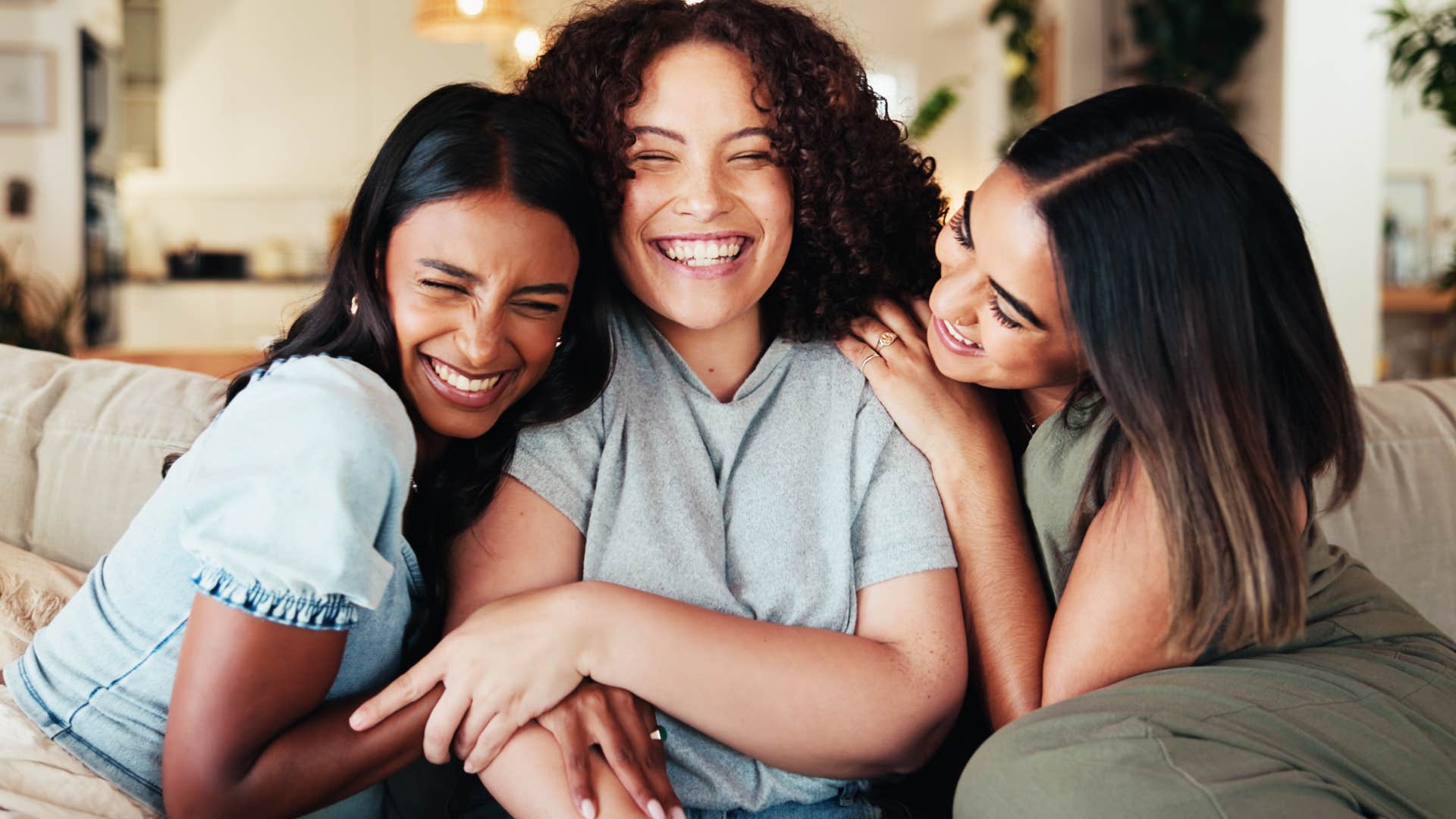 group of friends with good energy hugging