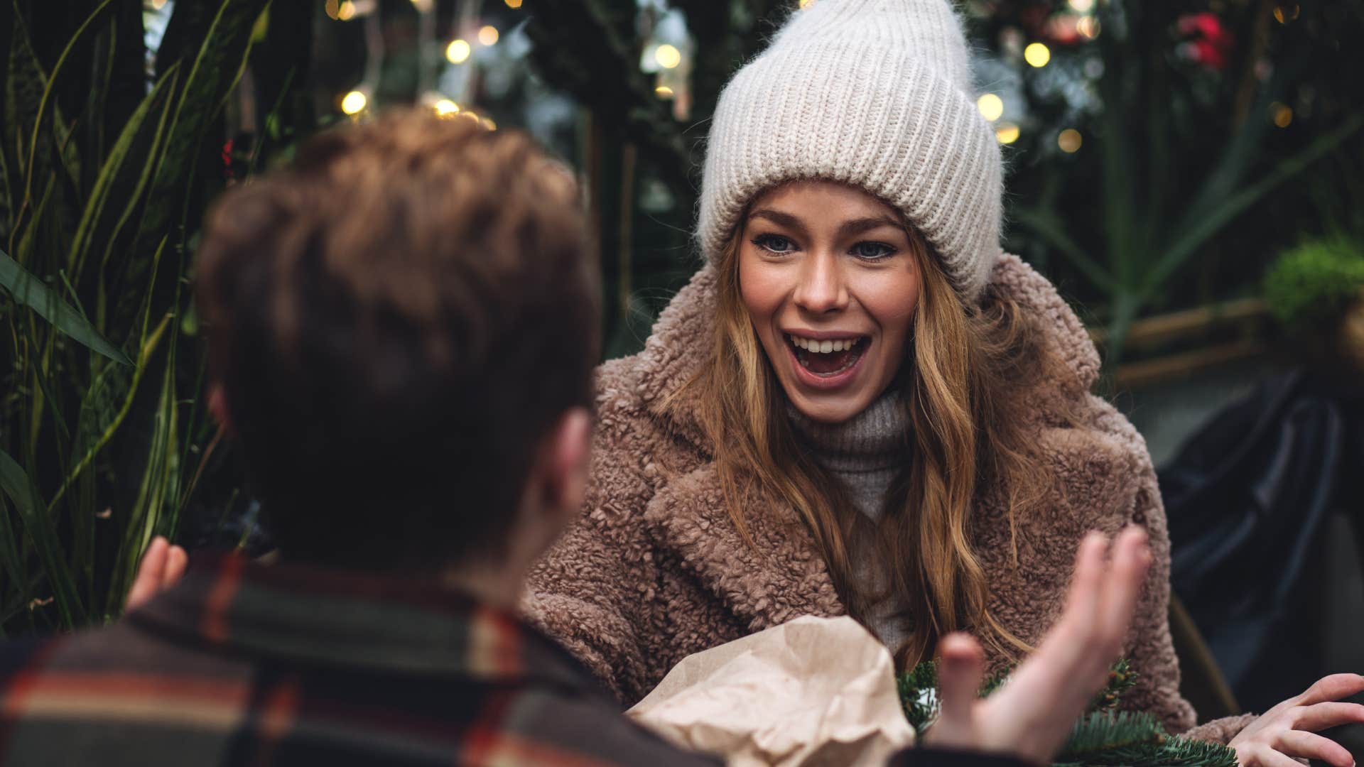 woman who follows her curiosity looking happy talking with a friend