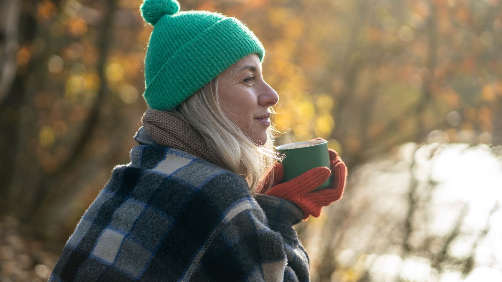 woman who needs alone time to recharge sitting outside