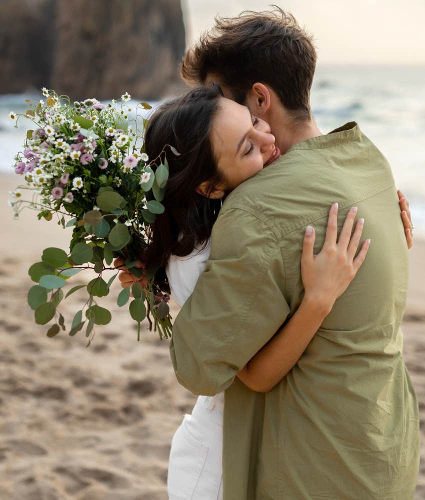 Loving spouses with flowers embrace showing present changes marriage