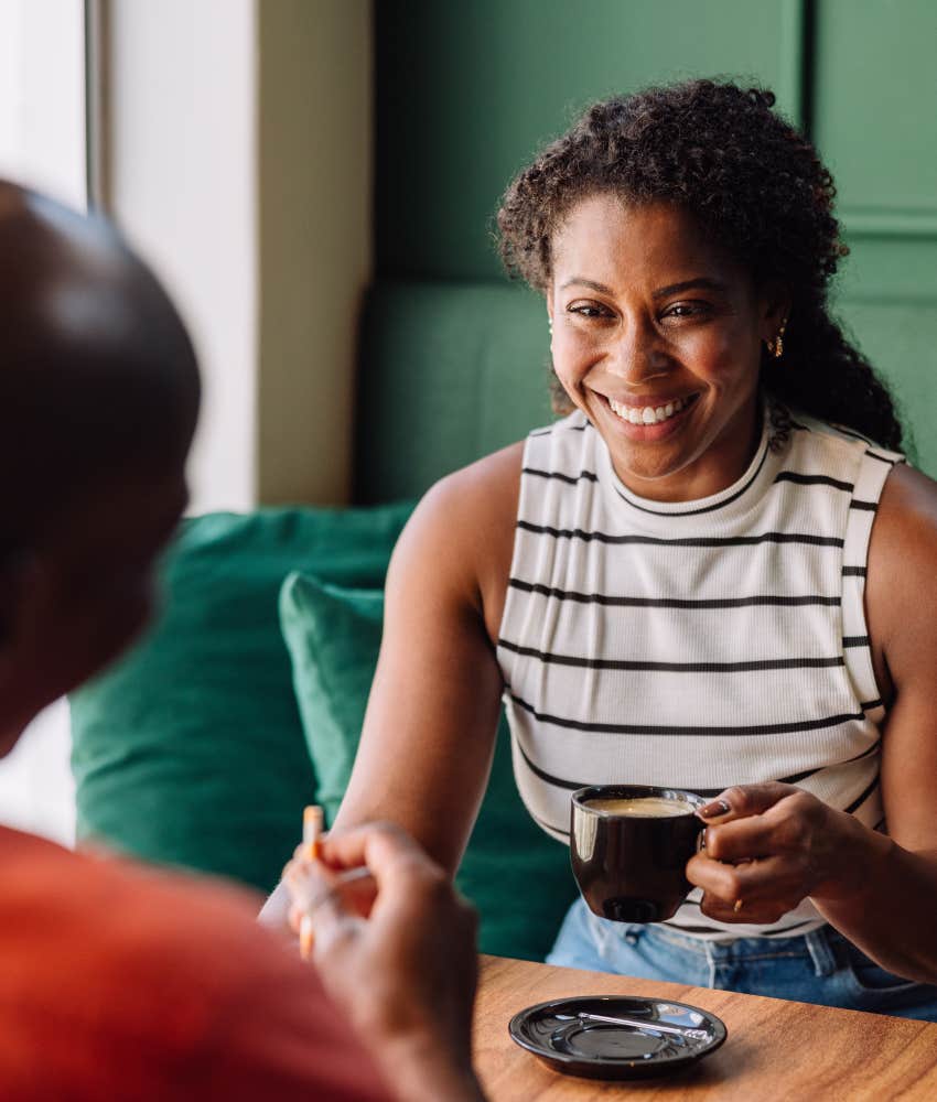 Happy person pauses conversation to smile showing emotional intelligence 