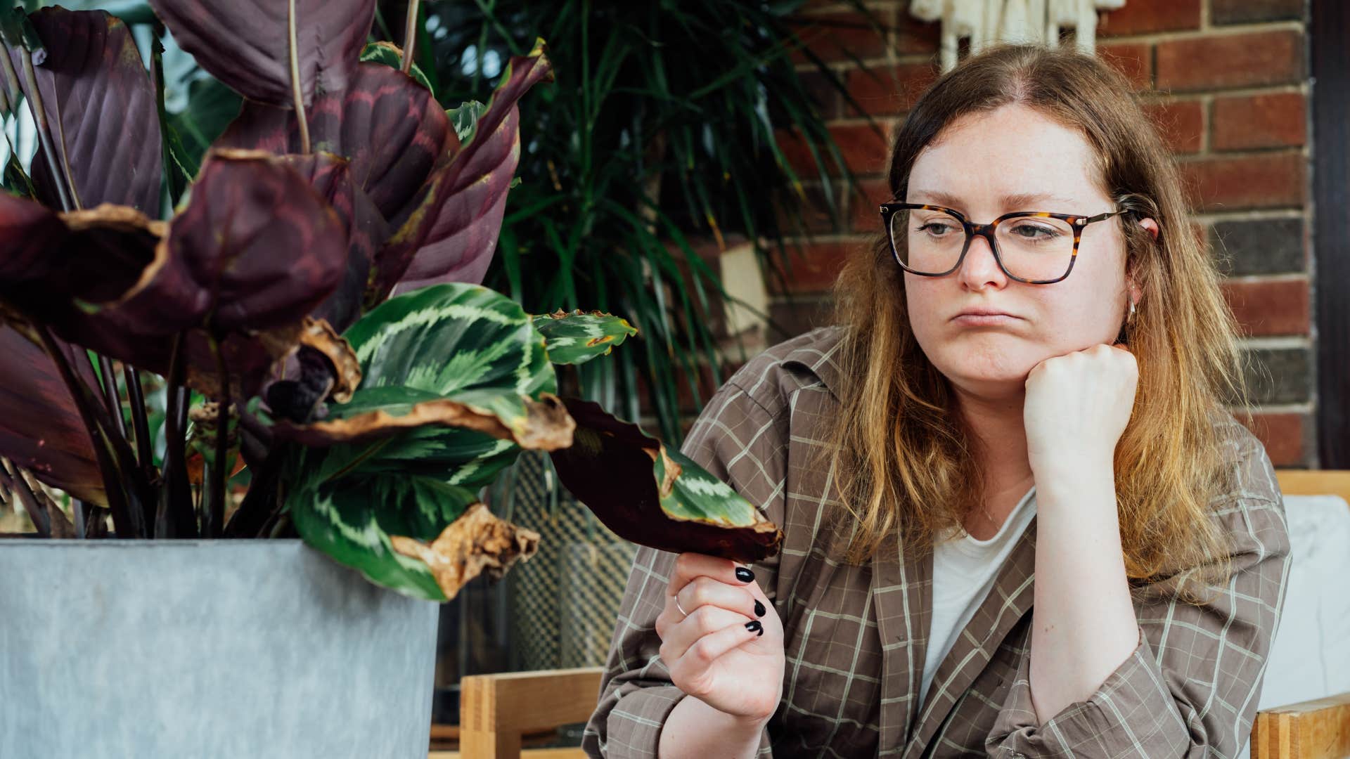 woman whose hobby was plants looking sad and disconnected