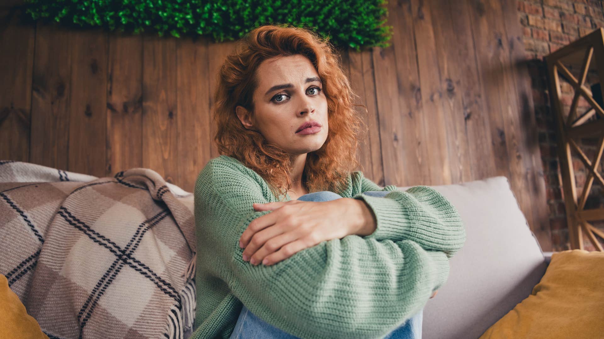 sad woman feeling guilty for resting at home
