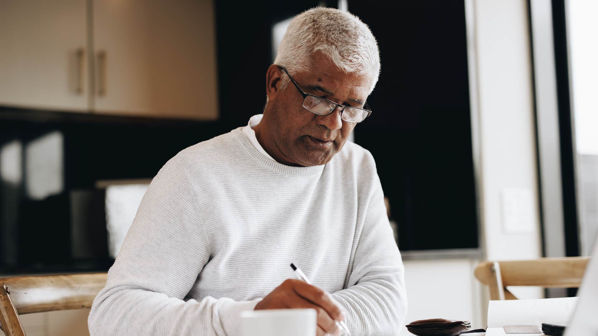 Grateful person writes in journal showing secret to best couples