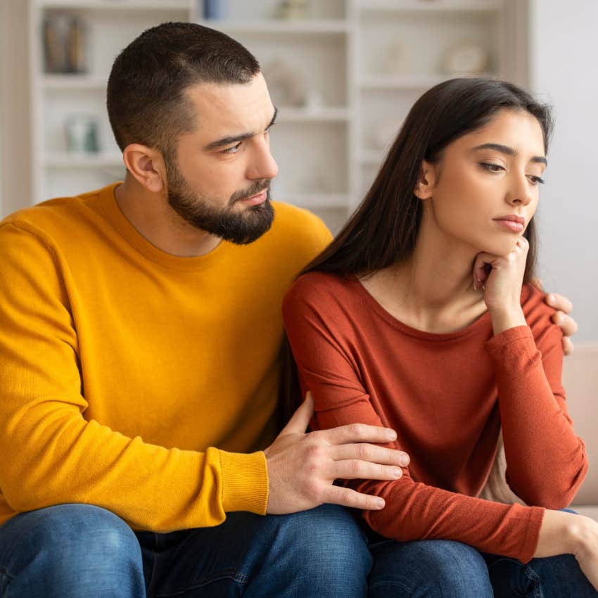 husband comforting bride after friend used destination wedding free honeymoon 