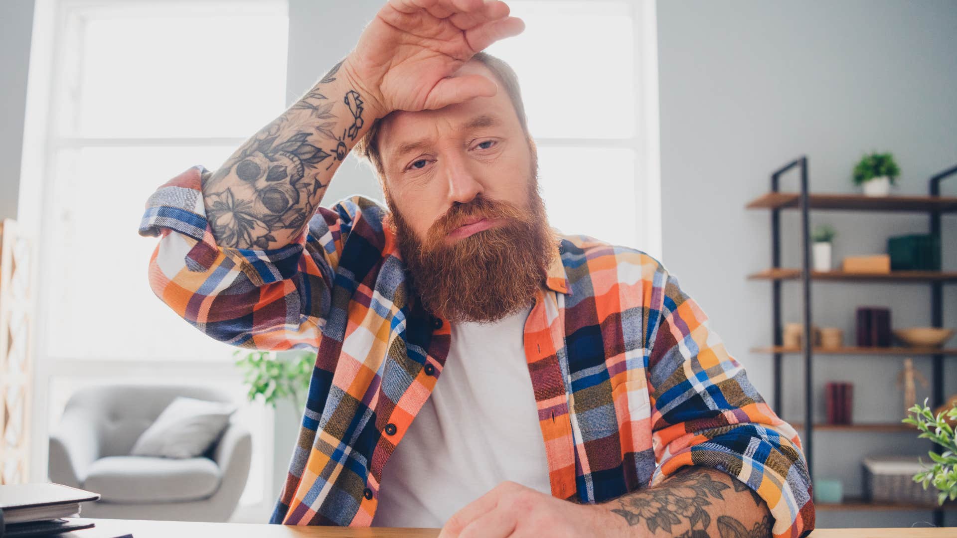 fatigued man looking tired saying pray for my absence, I've chosen peace over nonsense